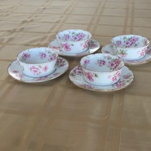 Set of 4 small dishes and saucers